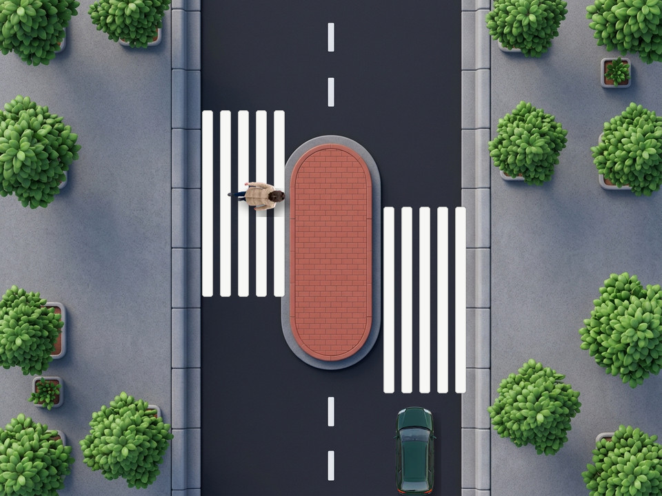 Een gevleugeld zebrapad: de witte strepen zijn verlengd tegen de rijrichting in, zodat bestuurders verder van het oversteekpunt stoppen en voetgangers beter zien, vooral vrachtwagenchauffeurs die hoog zitten. De groene break stopt vóór de lange strepen.